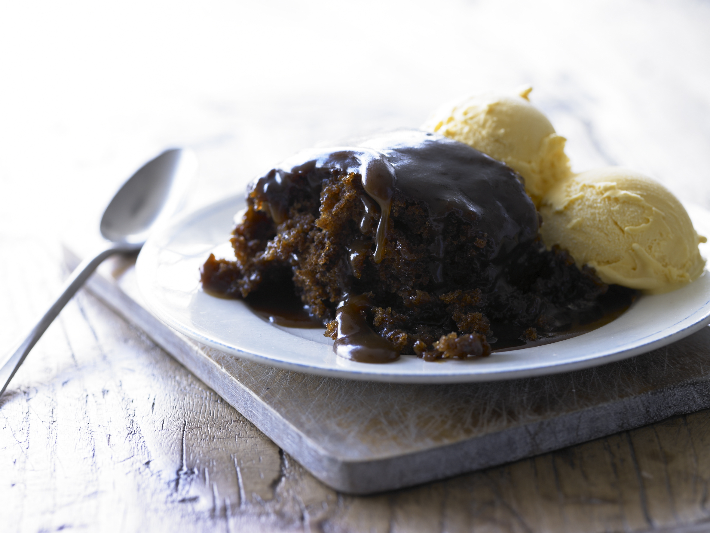 Cartmel sticky toffee pudding serving with ice cream